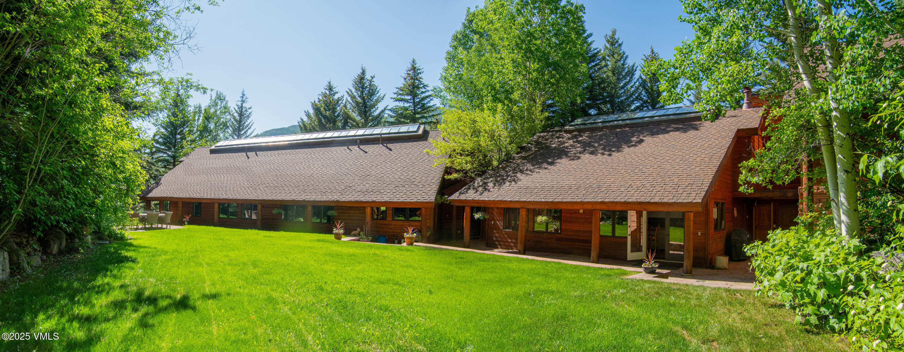 1461 Greenhill Court, Unit A AND B Vail, CO 81657 - Photo 27 of 44 a view of house with garden and entertaining space