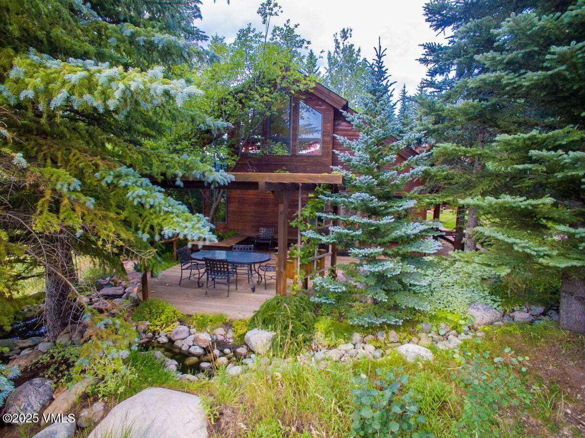 1461 Greenhill Court, Unit A AND B Vail, CO 81657 - Photo 43 of 44 a view of a house with a yard and sitting area