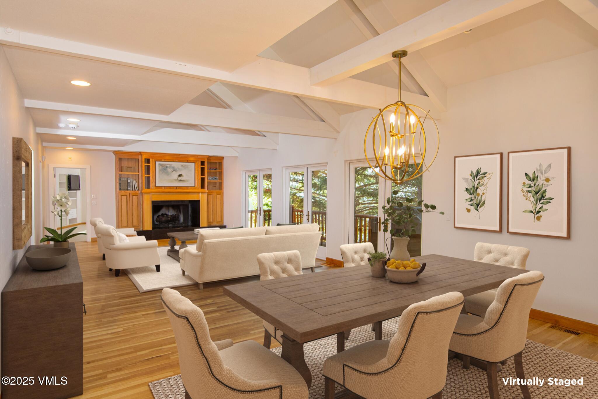 1461 Greenhill Court, Unit A AND B Vail, CO 81657 - Photo 5 of 44 a view of a dining room with furniture wooden floor and chandelier