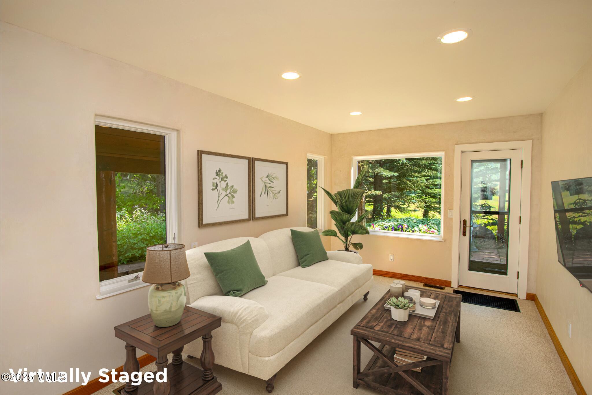 1461 Greenhill Court, Unit A AND B Vail, CO 81657 - Photo 7 of 44 a living room with furniture and a large window