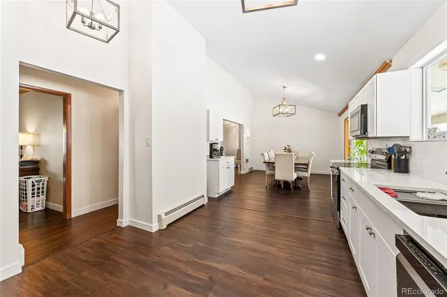 a view of room with a fireplace and wooden floor