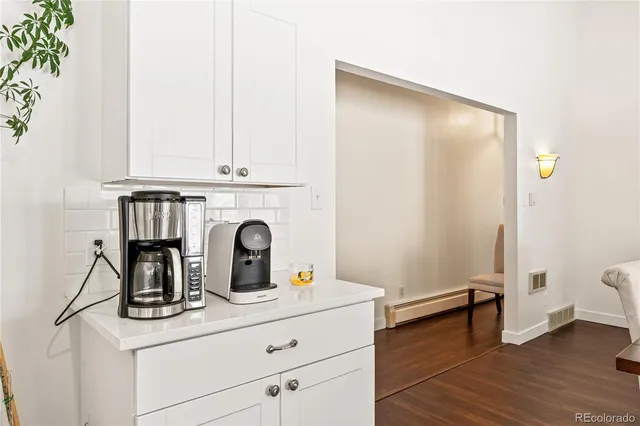 a room with a window and wooden floor