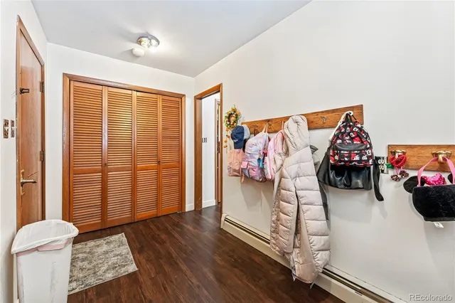 a bedroom with bed and a chandelier