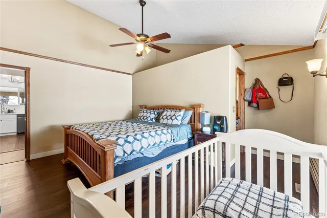 a view of a hallway with a living room and furniture