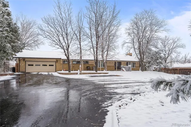 a view of a city with snow on the road
