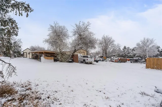 a view of a patio with a table and chairs