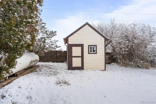 a view of a house with snow on the road