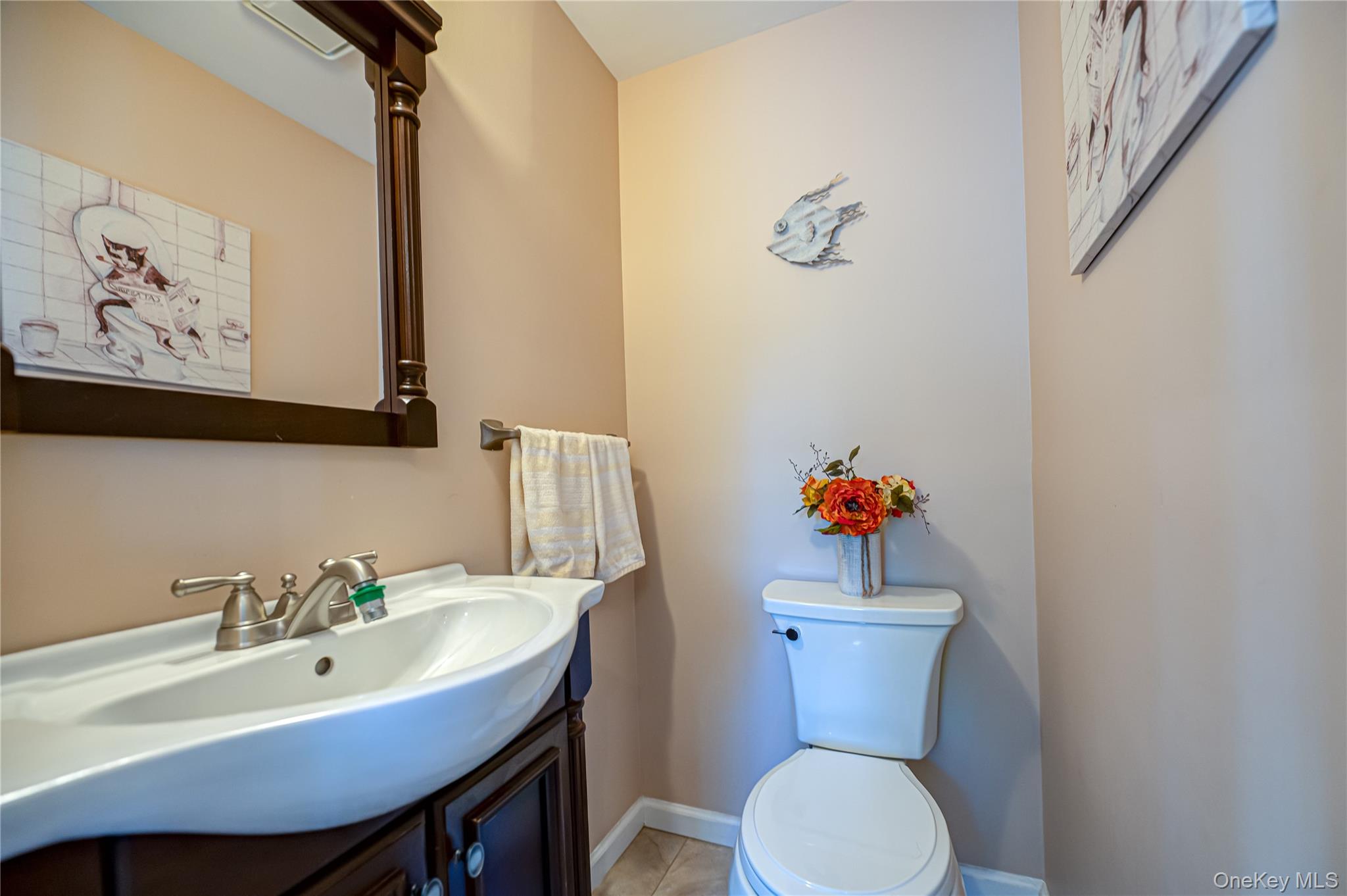 20 Bayview Road Amityville, NY 11701 - Photo 11 of 24 a bathroom with a sink a toilet and a mirror