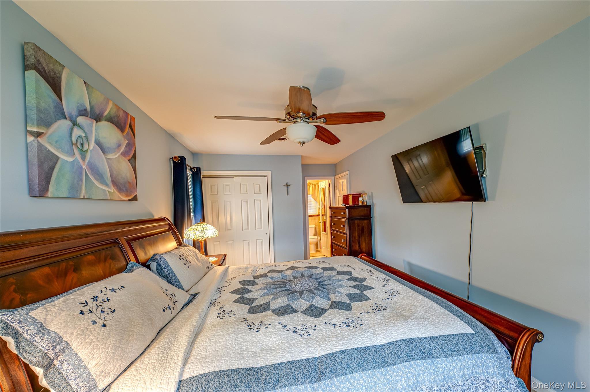 20 Bayview Road Amityville, NY 11701 - Photo 13 of 24 a bedroom with a bed and a flat screen tv