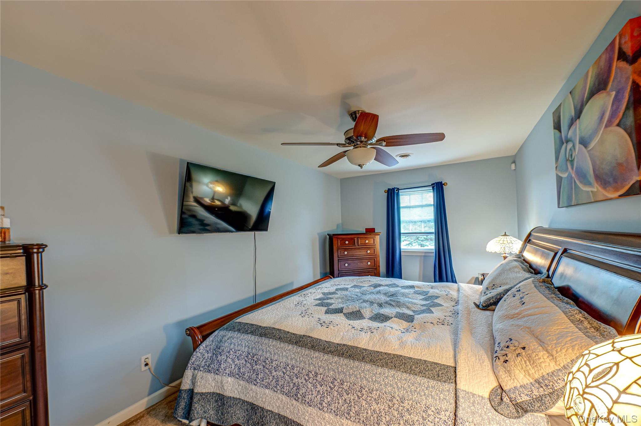20 Bayview Road Amityville, NY 11701 - Photo 14 of 24 a bedroom with a bed and a flat screen tv