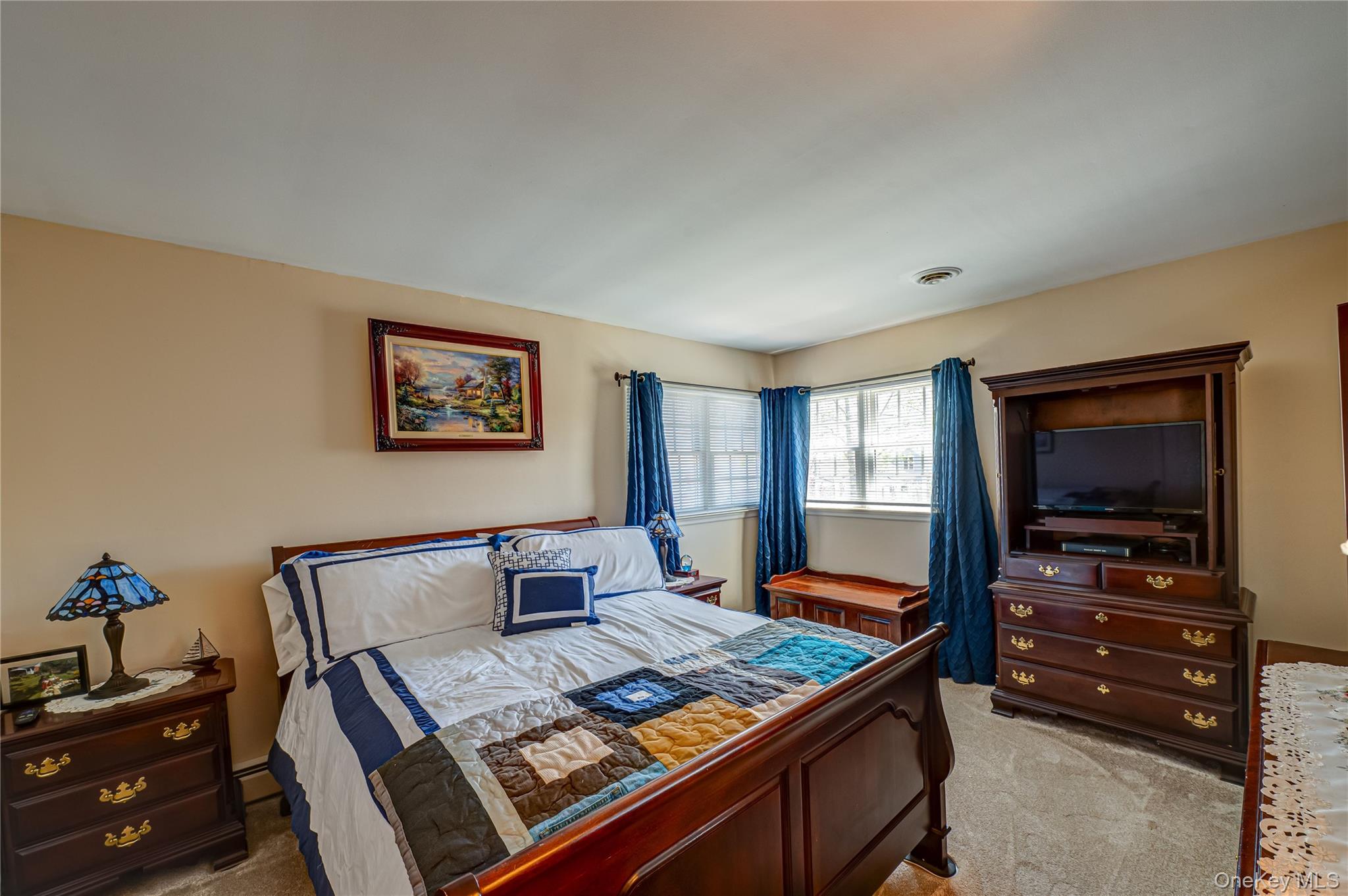 20 Bayview Road Amityville, NY 11701 - Photo 18 of 24 a living room with furniture and a flat screen tv