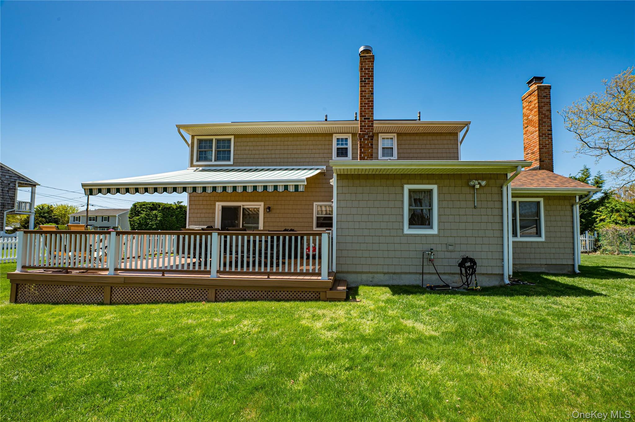20 Bayview Road Amityville, NY 11701 - Photo 20 of 24 a front view of a house with garden