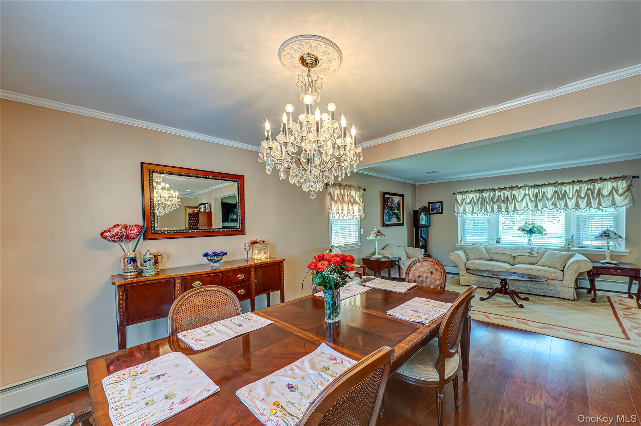 20 Bayview Road Amityville, NY 11701 - Photo 4 of 24 a view of a dining room with furniture a chandelier and wooden floor