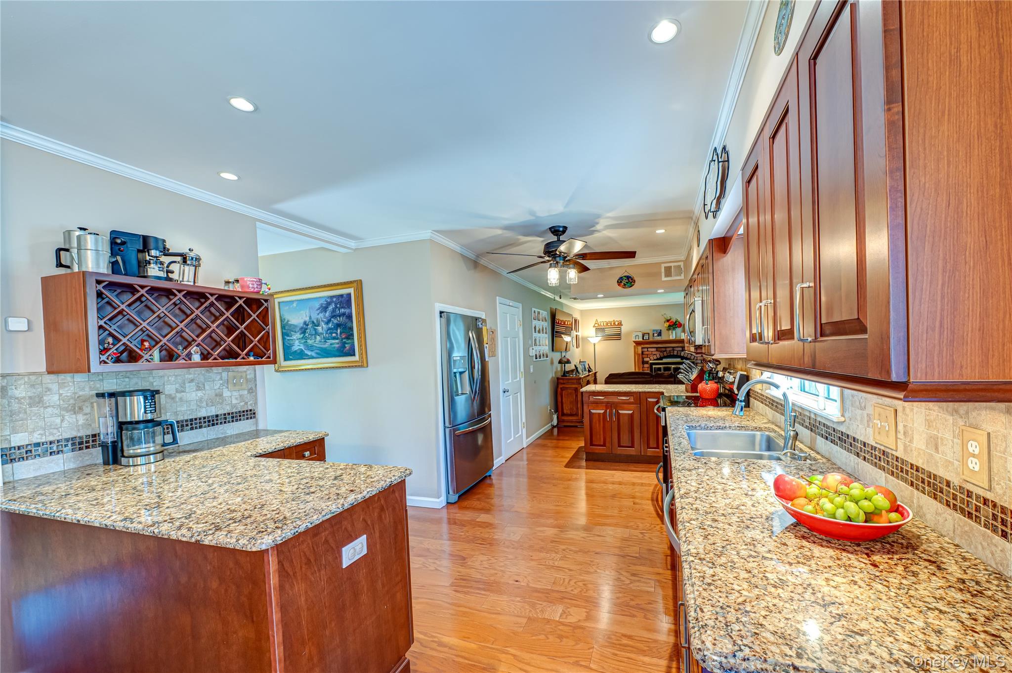 20 Bayview Road Amityville, NY 11701 - Photo 7 of 24 a living room with stainless steel appliances kitchen island granite countertop furniture and a view of kitchen