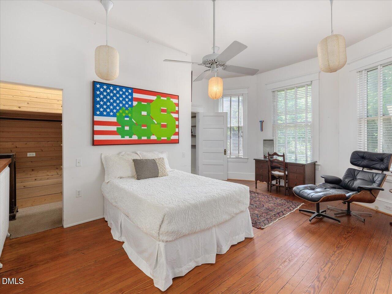 215 Hillcrest Road Raleigh, NC 27605 - Photo 55 of 97 a bedroom with a bed and a flat screen tv