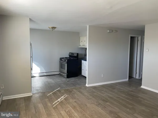 an empty room with wooden floor