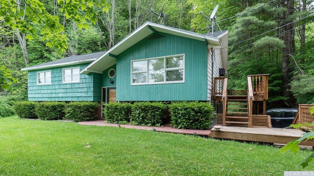 14042 Highway 23 Prattsville, NY 12468 - Photo 1 of 43 a front view of a house with a yard