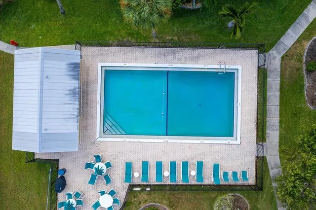 a view of a backyard with sitting area
