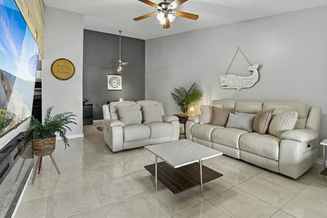 a living room with furniture and a window