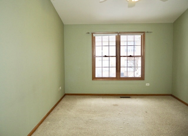 11904 Somerset Road Orland Park, IL 60467 - Photo 22 of 38 an empty room with a window