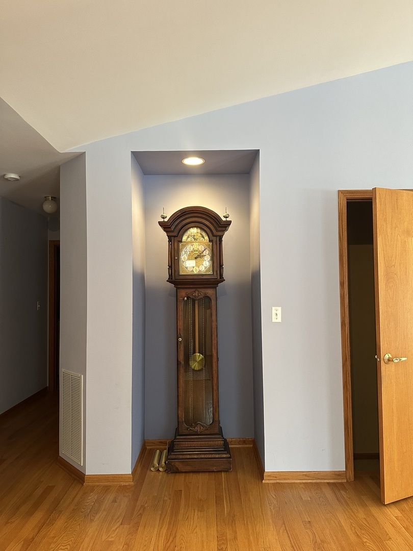 11904 Somerset Road Orland Park, IL 60467 - Photo 10 of 38 a view of a livingroom with wooden floor and a large window