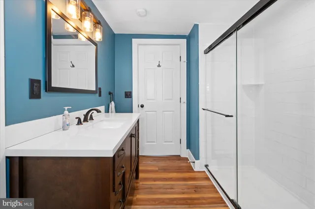 a bedroom with a large bed and a large window