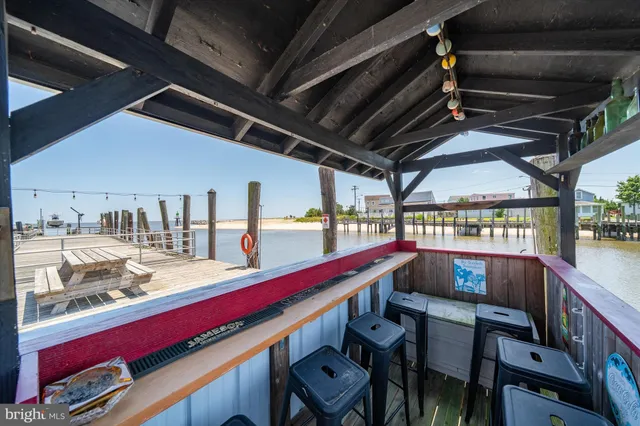 a view of a chairs and table in the balcony