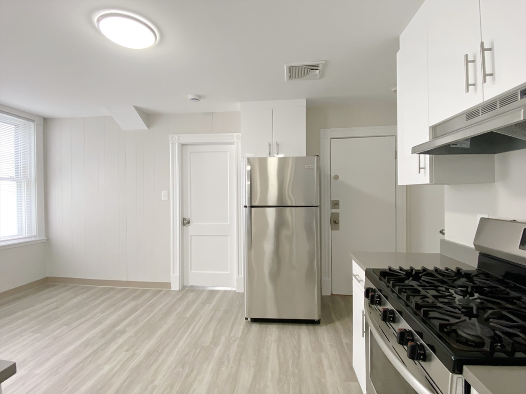 44 Jones Road, Unit 5 Revere, MA 02151 - Photo 3 of 11 a kitchen with a refrigerator and a stove