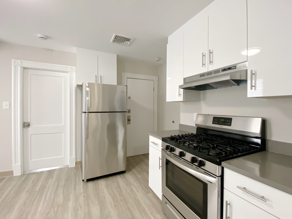 44 Jones Road, Unit 5 Revere, MA 02151 - Photo 4 of 11 a kitchen with appliances and cabinets
