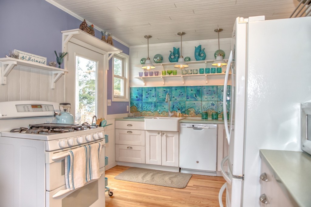 74 Ellendale Circle Springfield, MA 01128 - Photo 1 of 24 a kitchen with white cabinets and white appliances