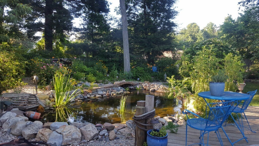 74 Ellendale Circle Springfield, MA 01128 - Photo 20 of 24 a view of a patio with table and chairs and potted plants