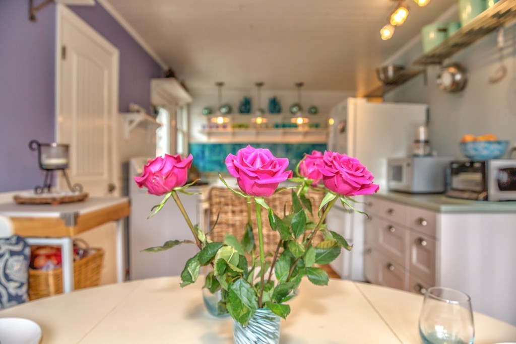 74 Ellendale Circle Springfield, MA 01128 - Photo 24 of 24 a view of a kitchen with kitchen island stainless steel appliances a chandelier and living room view