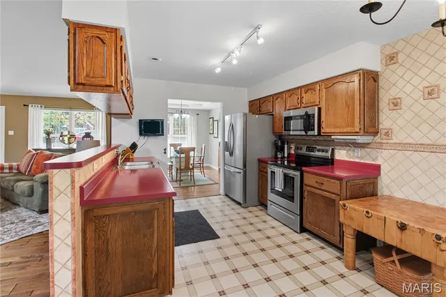 $409,900 | 709 Heatherstone Drive, High Ridge, MO 63049