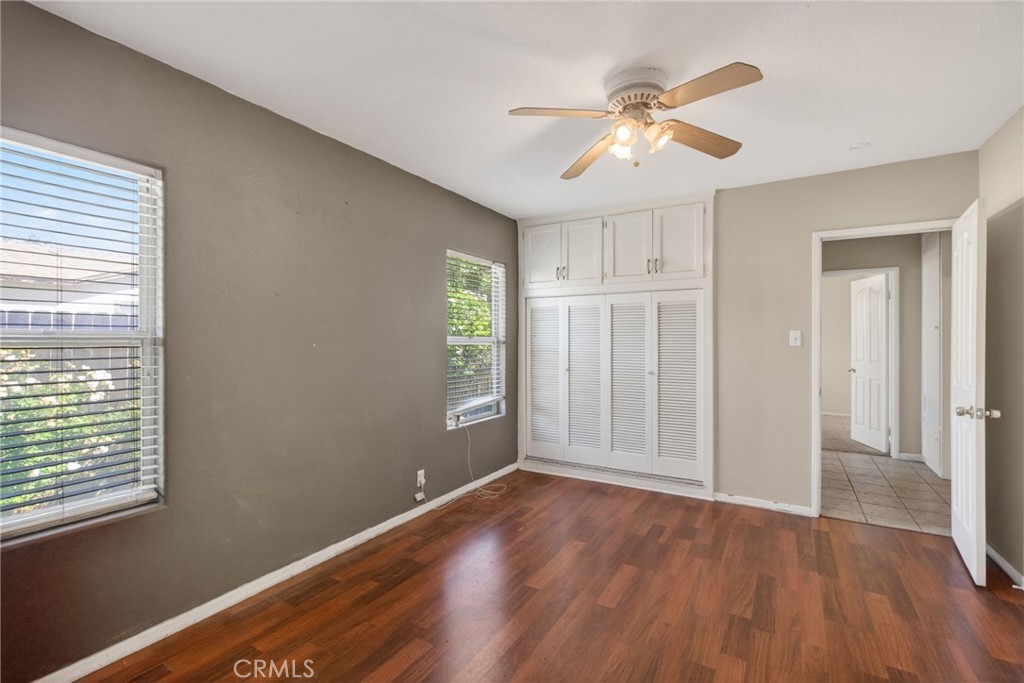3560 McKinley Street Riverside, CA 92506 - Photo 14 of 45 a view of an empty room with wooden floor and a window