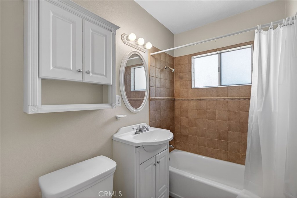 3560 McKinley Street Riverside, CA 92506 - Photo 18 of 45 a bathroom with a sink a toilet and shower
