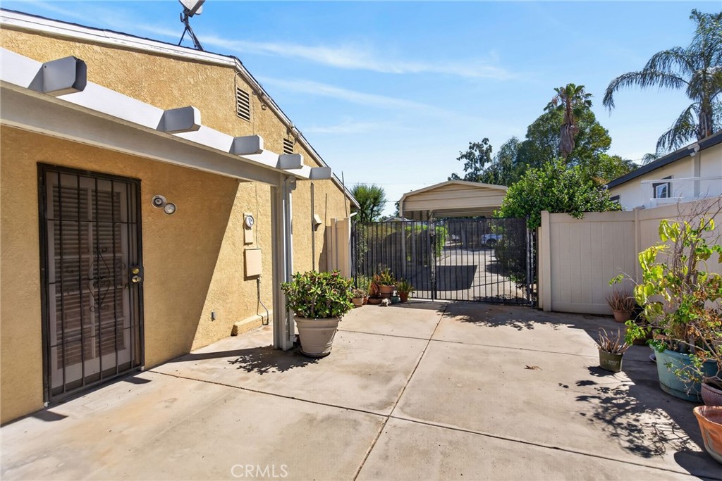 3560 McKinley Street Riverside, CA 92506 - Photo 27 of 45 a view of patio with a table and chairs under an umbrella