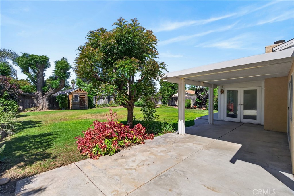 3560 McKinley Street Riverside, CA 92506 - Photo 29 of 45 a front view of a house with a yard and fountain in middle