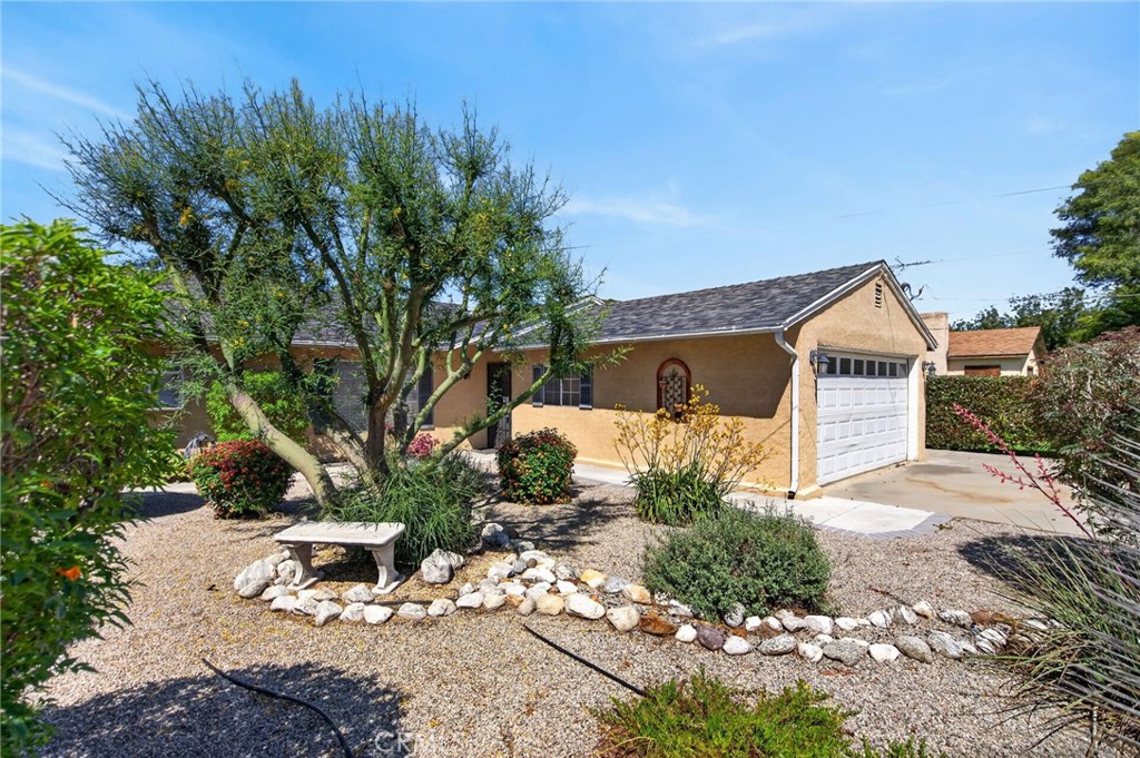3560 McKinley Street Riverside, CA 92506 - Photo 44 of 45 a view of a house with a yard and sitting area