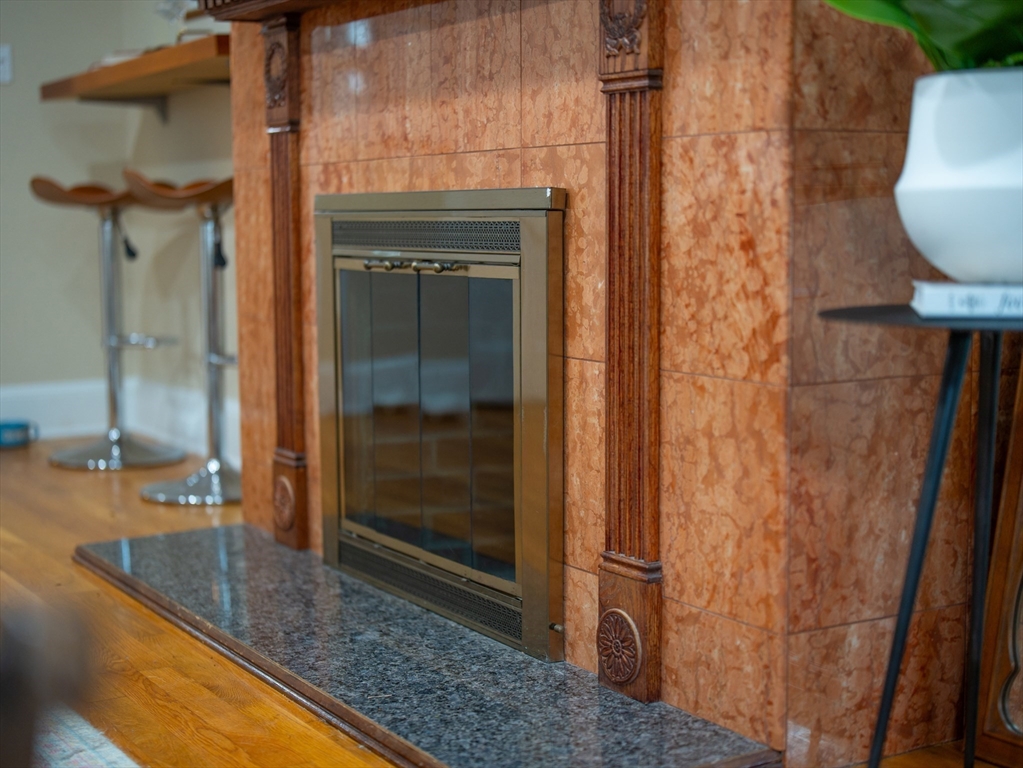 352 Tappan Street, Unit 1 Brookline, MA 02445 - Photo 12 of 42 a bathroom with a granite countertop sink and a mirror