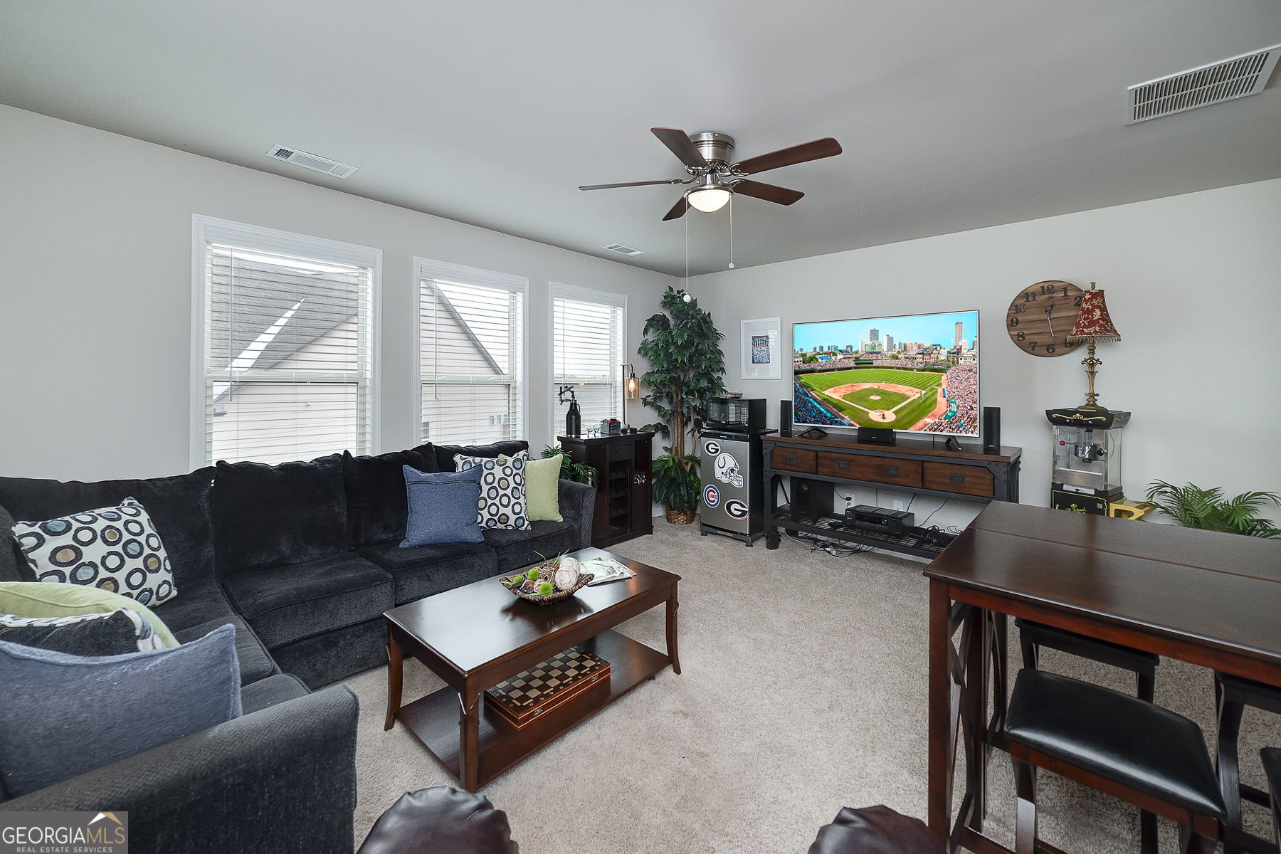 4366 Clubside Drive Gainesville, GA 30504 - Photo 22 of 24 a living room with furniture a window and a flat screen tv