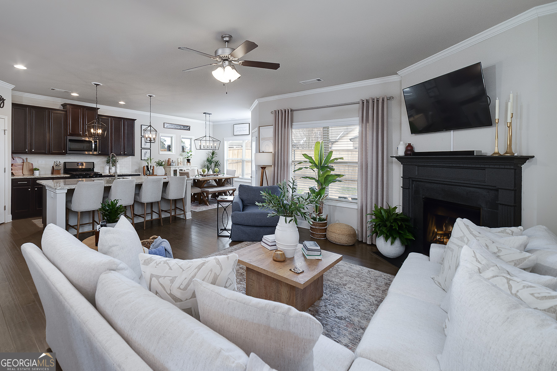 4366 Clubside Drive Gainesville, GA 30504 - Photo 5 of 24 a living room with furniture a flat screen tv and a fireplace