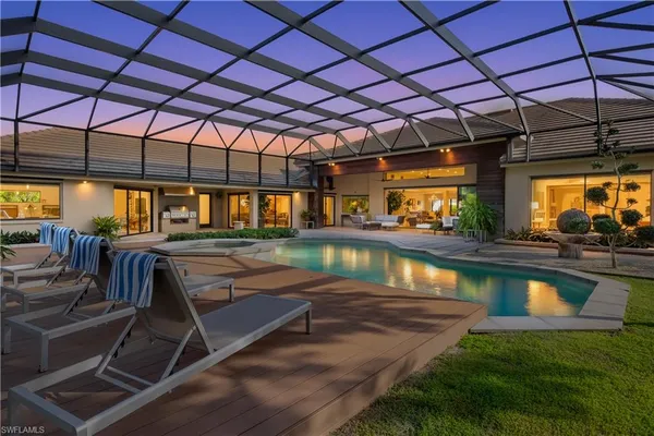 a view of a swimming pool with a patio
