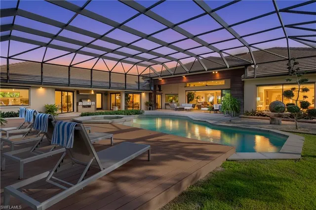 a view of a swimming pool with a patio