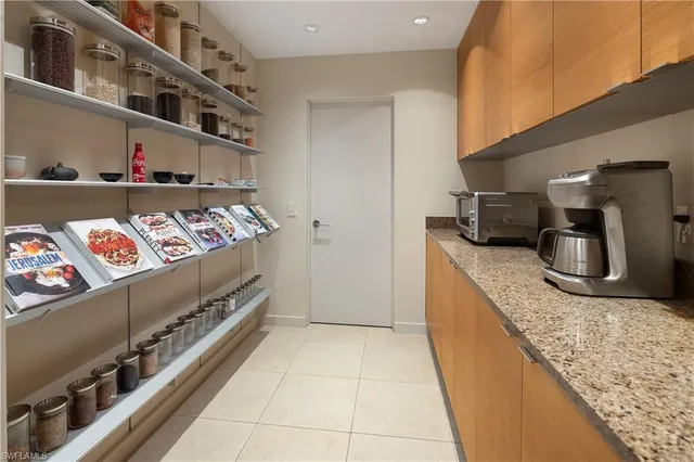 a kitchen with stainless steel appliances granite countertop a sink and a stove