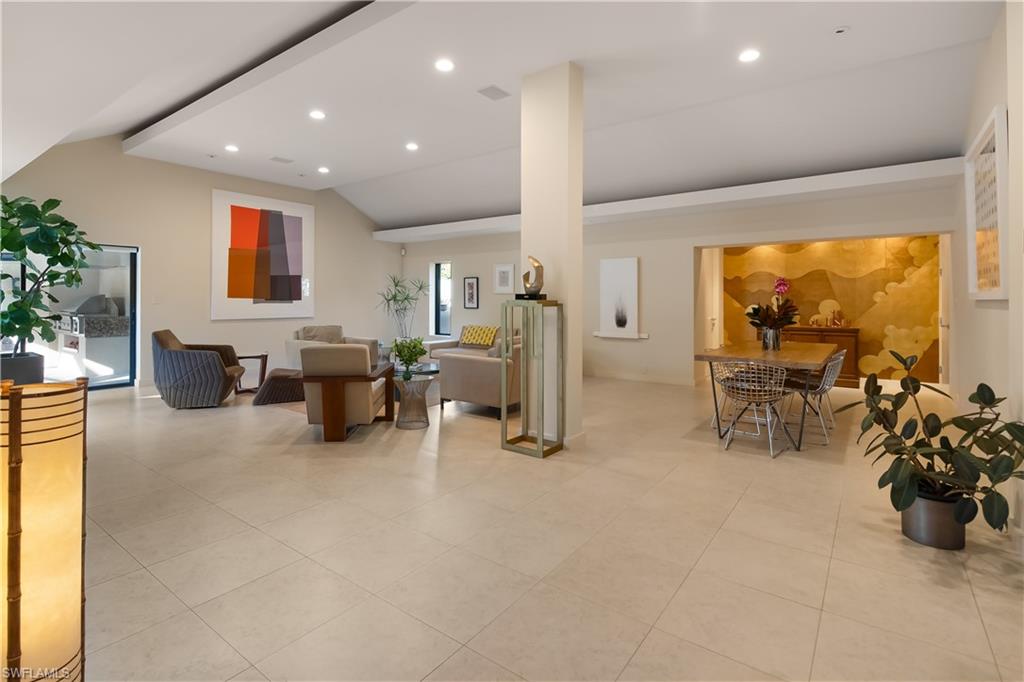 705 Shadow Lake Lane Naples, FL 34108 - Photo 12 of 47 a living room with furniture and a large window