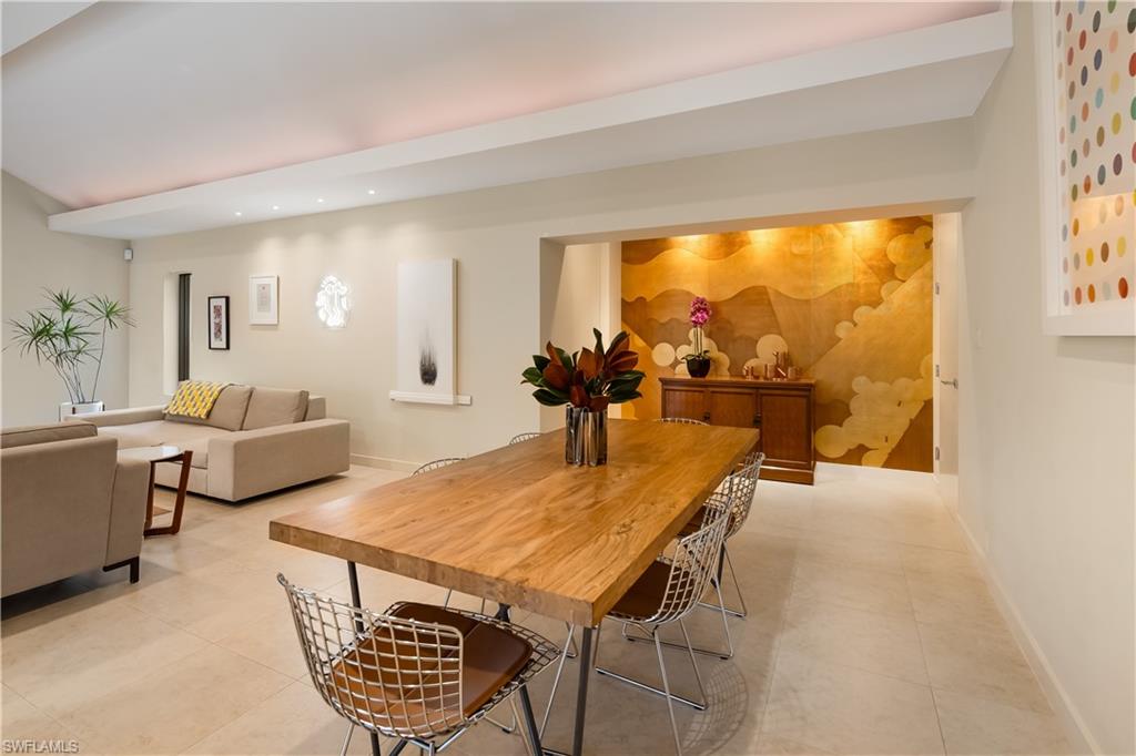 705 Shadow Lake Lane Naples, FL 34108 - Photo 13 of 47 a living room with furniture a rug and a large window