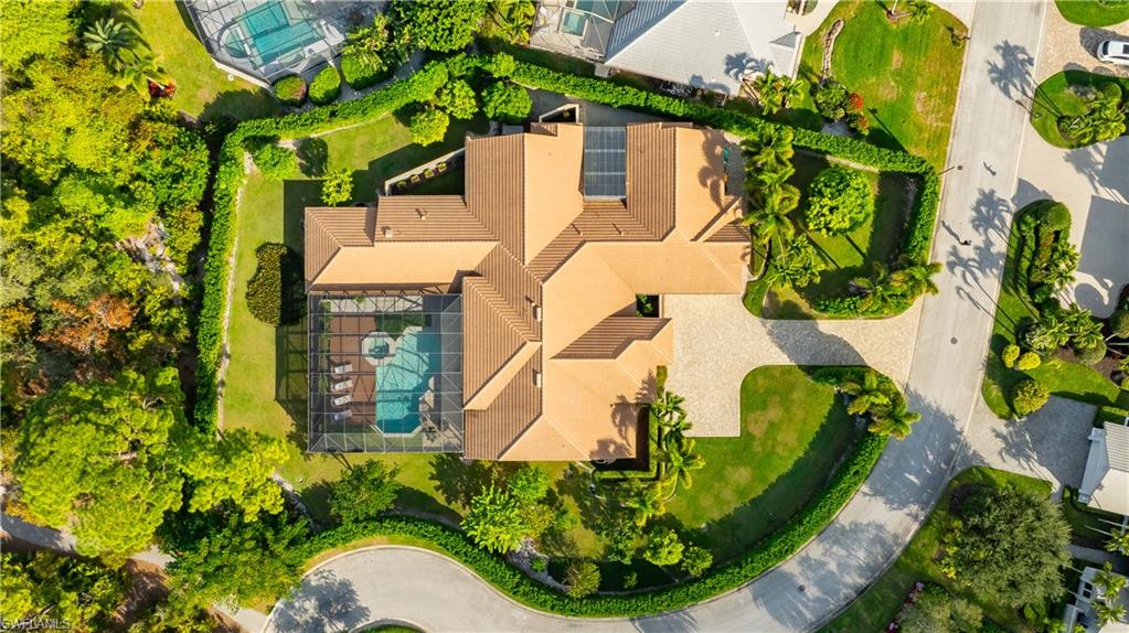 705 Shadow Lake Lane Naples, FL 34108 - Photo 17 of 47 a view of a plant in a garden