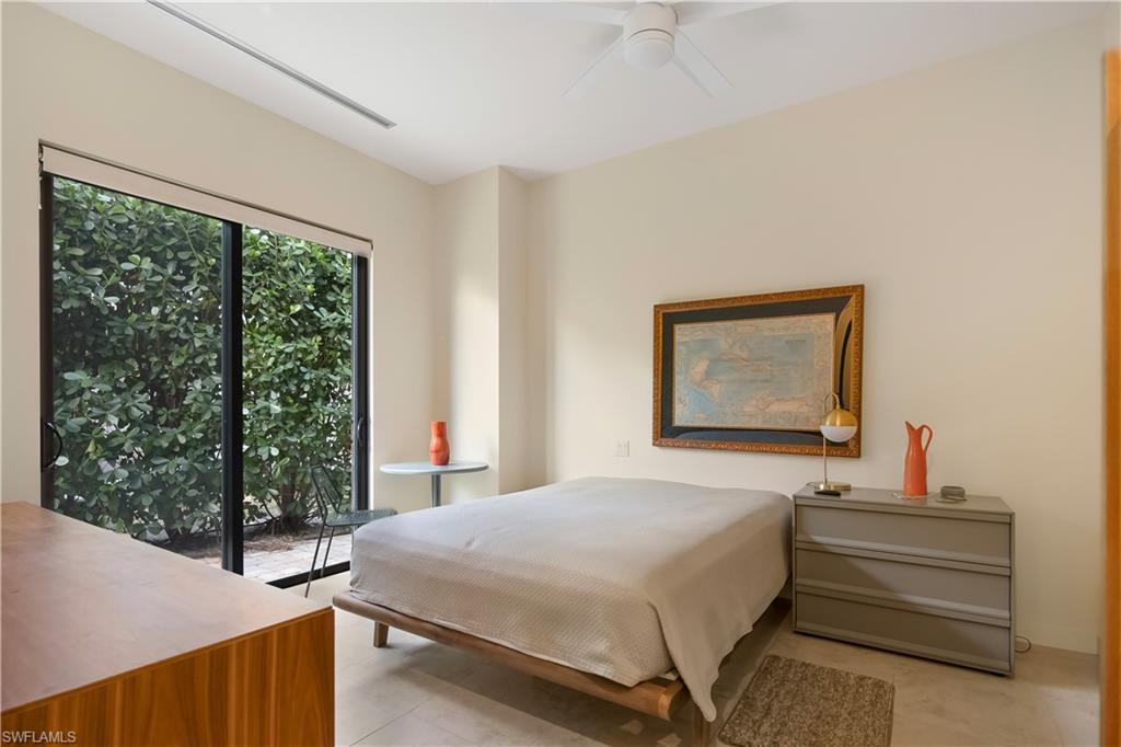 705 Shadow Lake Lane Naples, FL 34108 - Photo 29 of 47 a bedroom with a bed and a window