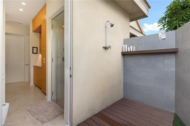 a view of a room with wooden floor and a ceiling fan