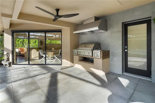 a view of a kitchen with a sink and a refrigerator